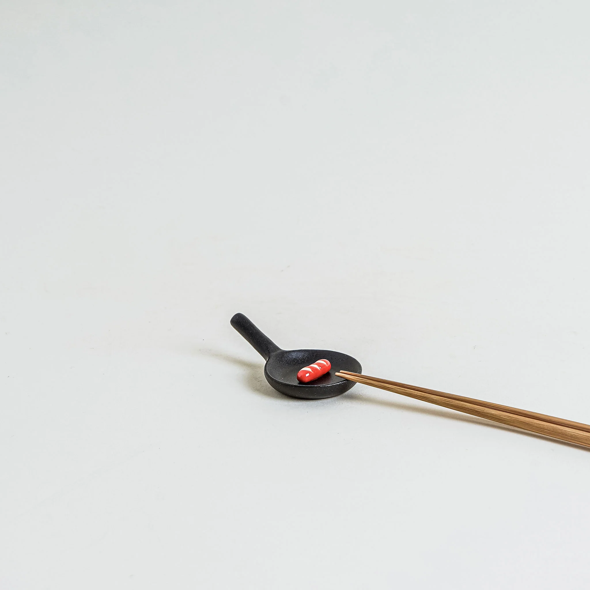 Frying Pan Sausage Chopstick Rest - Image 2